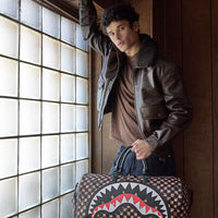 SPRAYGROUND® DUFFLE PEEKING CHARACTERS REMIX DUFFLE