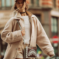 SPRAYGROUND® POUCHETTE CREAM AND BROWN TEAR CHECK CROSSOVER CLUTCH