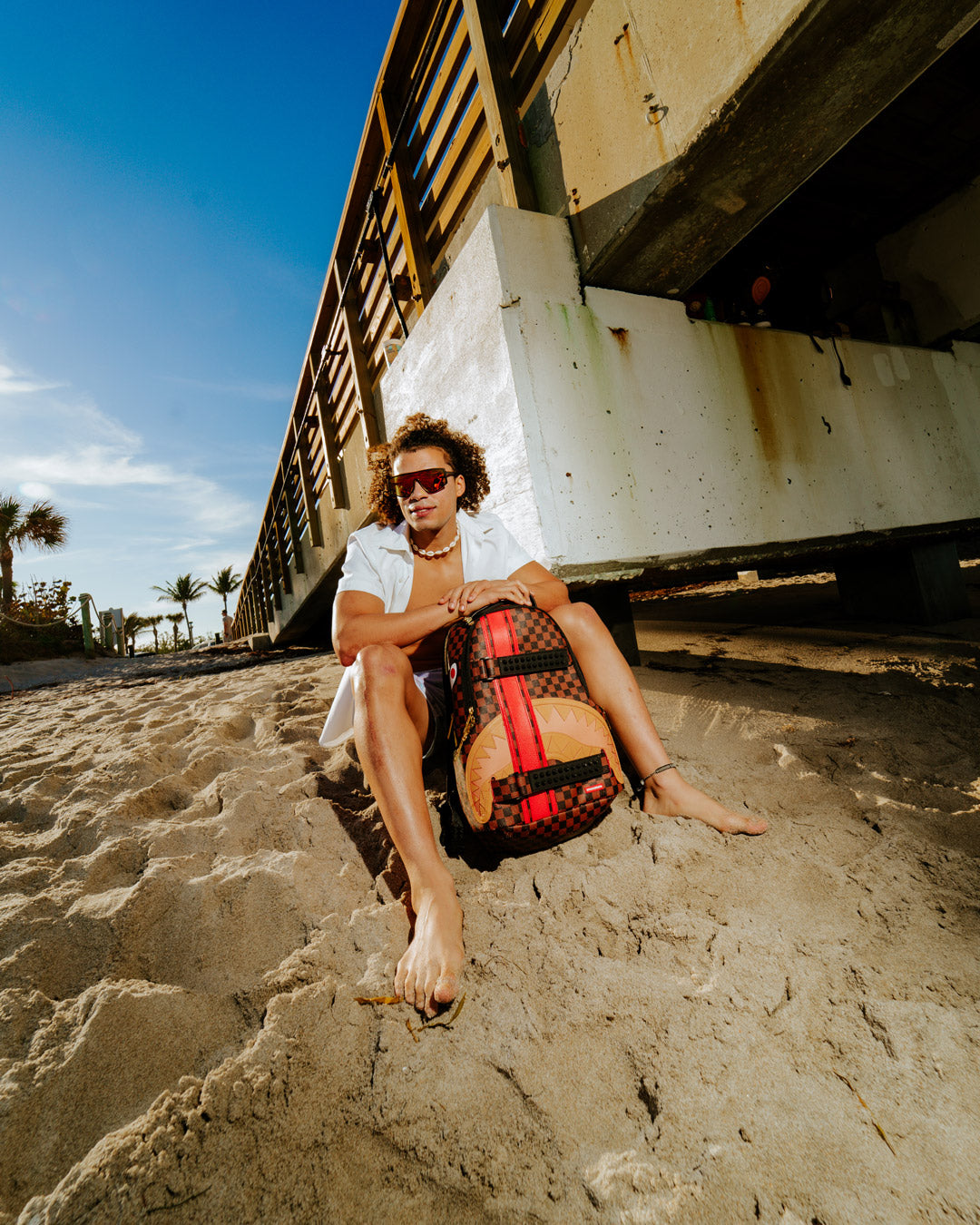 HENNY VICTORY LAP SKATEBOARD-STRAP BACKPACK – SPRAYGROUND®