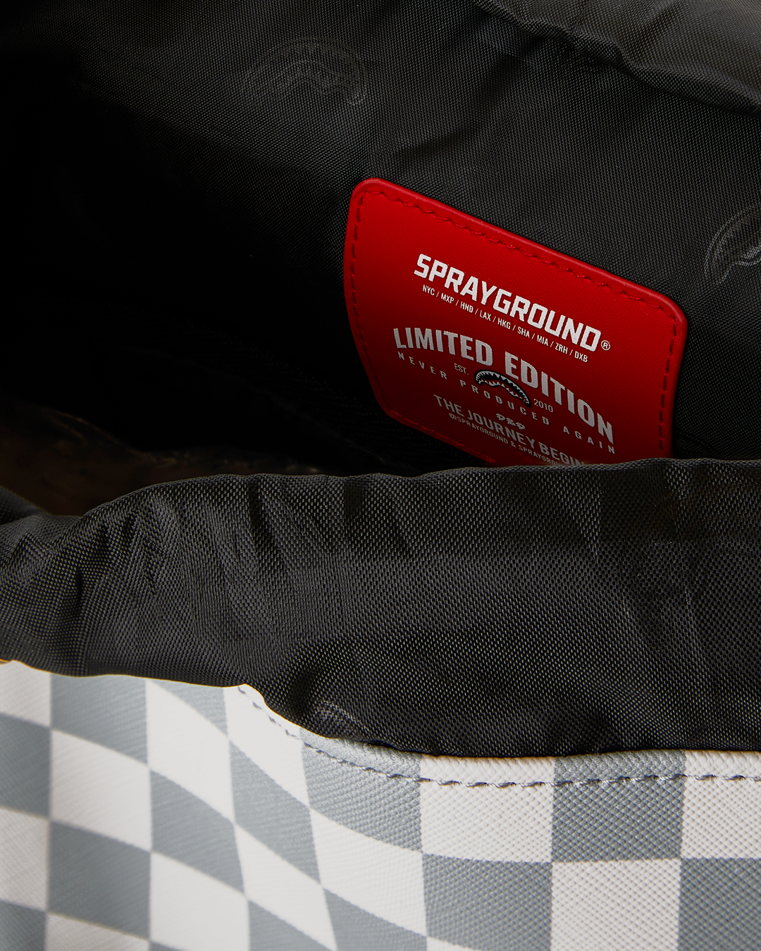 SPRAYGROUND® BACKPACK CREAM AND BROWN TEAR CHECK MONTE CARLO