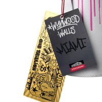 SPRAYGROUND® SPRAY PAINT CAN HOLDER WYNWOOD WALLS COLLAB WATER BOTTLE OR SPRAYCAN HOLDER (WHT/PNK)