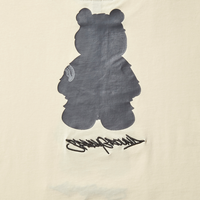 SPRAYGROUND® APPAREL SHORT SLEEVE GRAPHIC MONEY BEAR T-SHIRT (APRICOT)