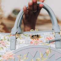 SPRAYGROUND® DUFFLE A.I. AFRICAN INTELLIGENCE ELEGANT ENERGY MINI DUFFLE - SANDFLOWER COLLAB