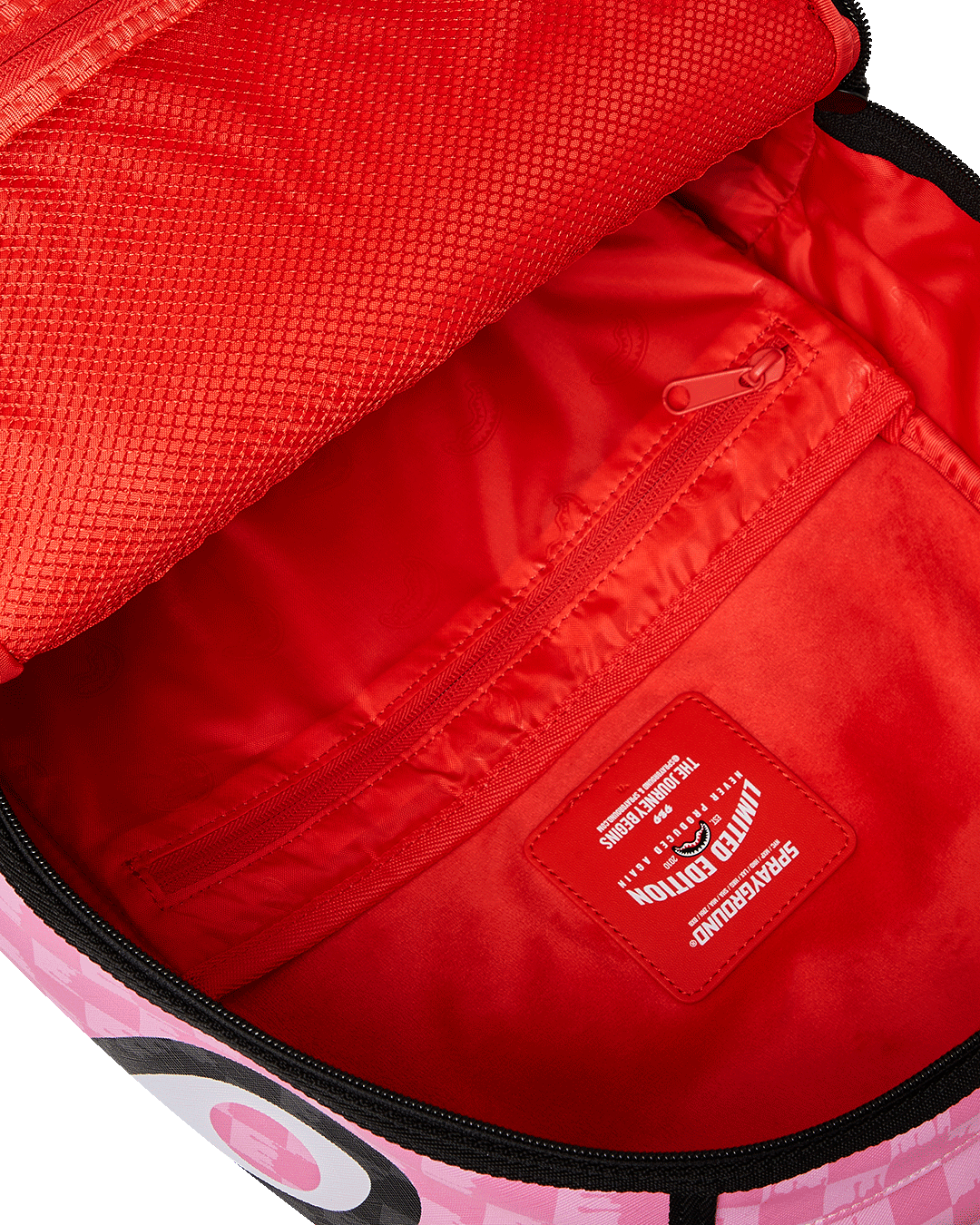 SPRAYGROUND® BACKPACK PINK AND BLACK DRIP CHECK DLXSV BACKPACK