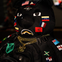 SPRAYGROUND® BACKPACK JAMES FLAGS MONEY BEAR BACKPACK