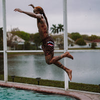 SPRAYGROUND® SWIM PEEKING CHARACTER CHECK SWIM SHORTS