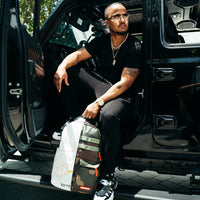 SPRAYGROUND® BACKPACK SPLIT WEIRD BACKPACK (DLXV)