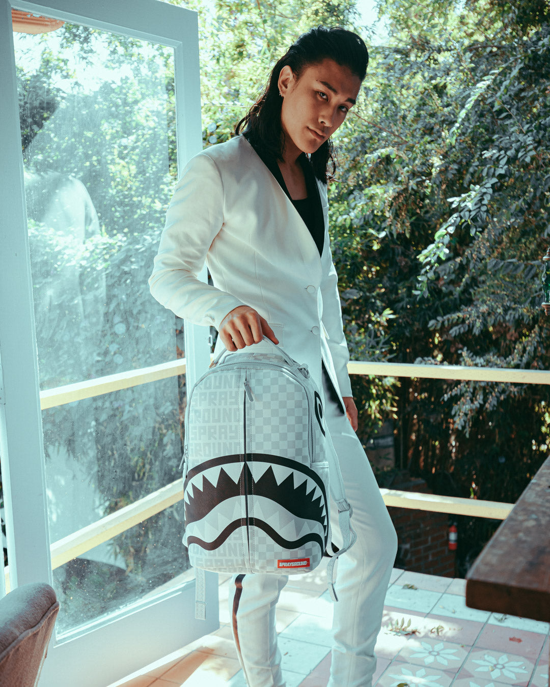 Sprayground split online the check backpack