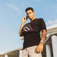 SPRAYGROUND® CROSSBODY HENNY AIIR TO THE THRONE SAVVY CROSSBODY