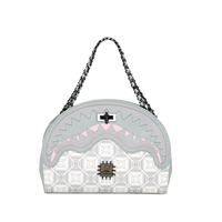 SPRAYGROUND® HANDBAG A.I.8 AFRICAN INTELLIGENCE BOOKED & BUSY SHARK HANDBAG