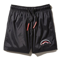 SPRAYGROUND® SWIM KIDS LIGHTS OUT SWIM TRUNKS