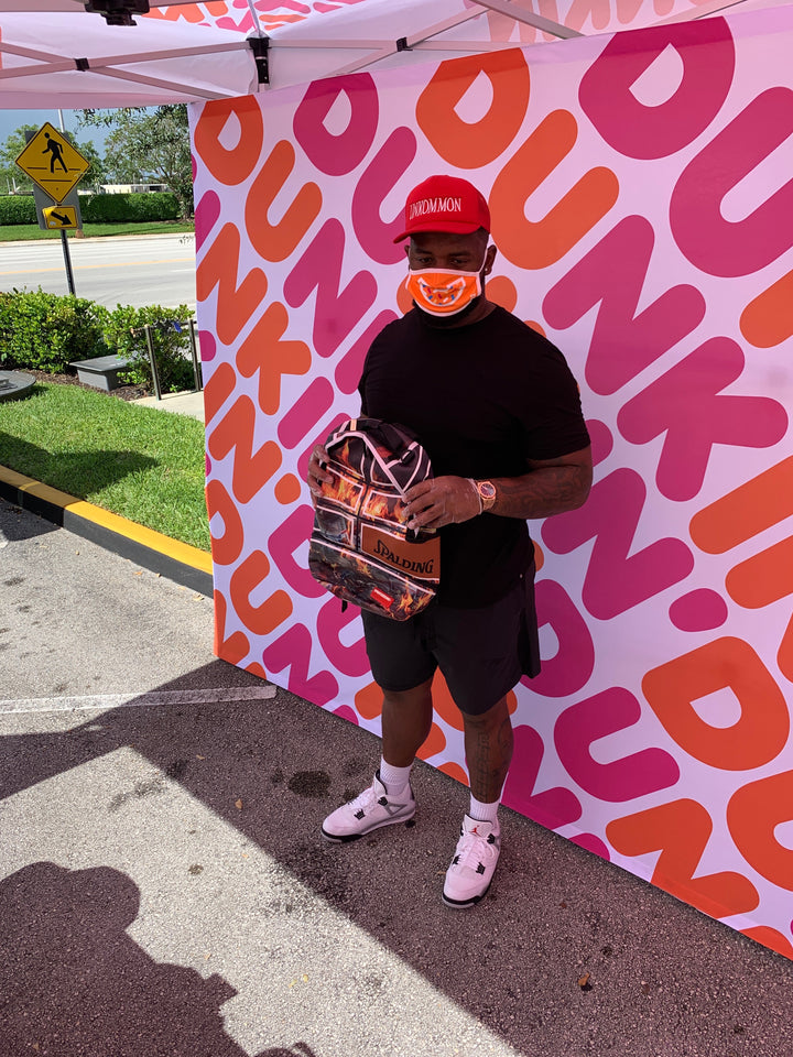 Dolphins' Davon Godchaux teams up to donate Sprayground backpacks to 150 kids