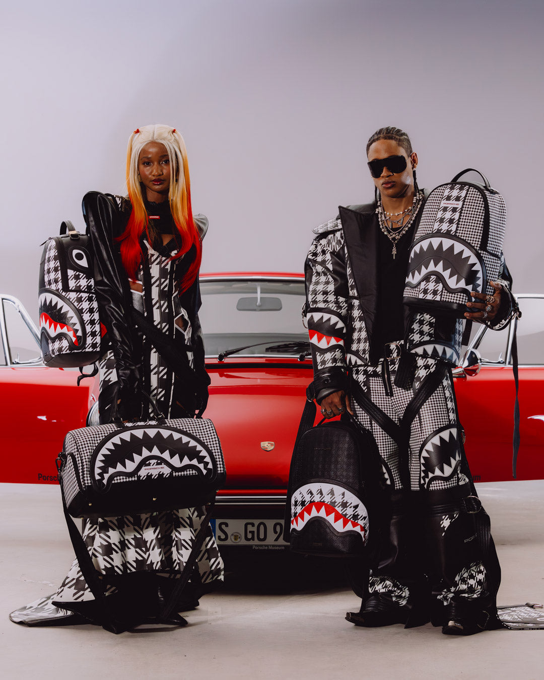 SPRAYGROUND® BACKPACK PORSCHE BLACK EMBOSSED PEPITA COLLAB BACKPACK - LIMITED EDITION
