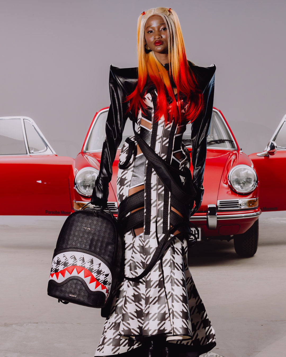 SPRAYGROUND® BACKPACK PORSCHE BLACK EMBOSSED PEPITA COLLAB BACKPACK - LIMITED EDITION