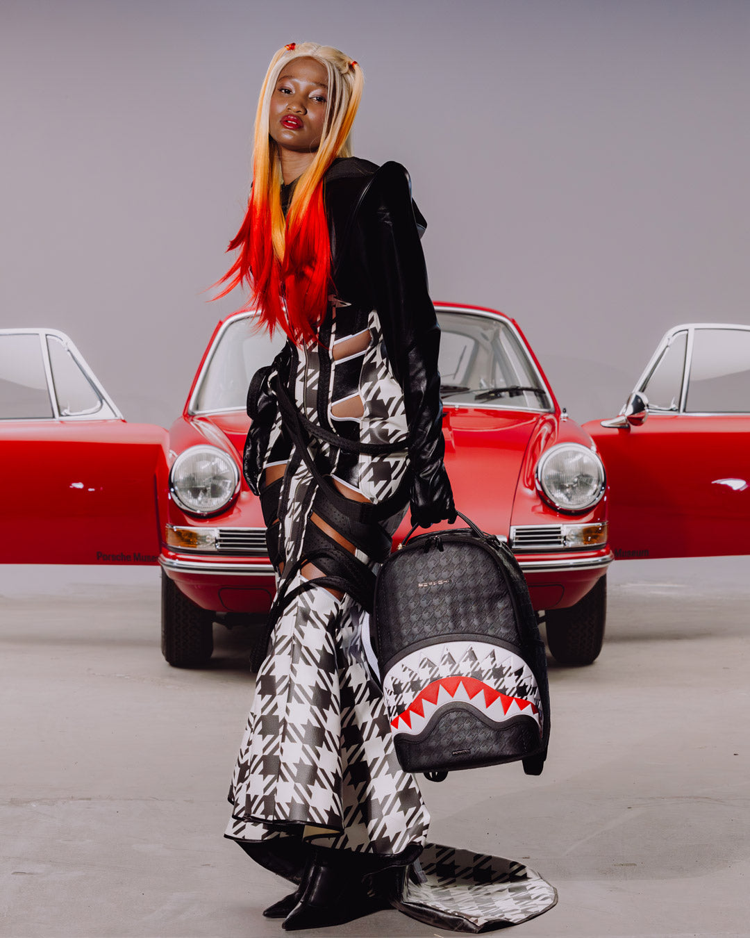 SPRAYGROUND® BACKPACK PORSCHE BLACK EMBOSSED PEPITA COLLAB BACKPACK - LIMITED EDITION