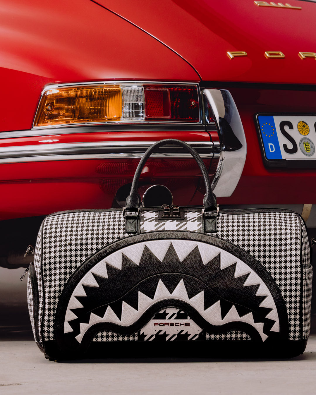 SPRAYGROUND® DUFFLE PORSCHE MIXED PEPITA SHARK COLLAB LARGE DUFFLE - LIMITED EDITION
