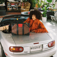 SPRAYGROUND® DUFFLE RED REDEMPTION PYRAMID DUFFLE