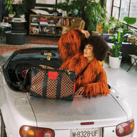 SPRAYGROUND® DUFFLE RED REDEMPTION PYRAMID DUFFLE