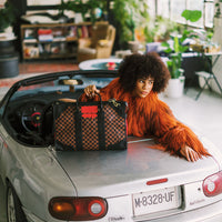 SPRAYGROUND® DUFFLE RED REDEMPTION PYRAMID DUFFLE