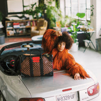 SPRAYGROUND® DUFFLE RED REDEMPTION PYRAMID DUFFLE