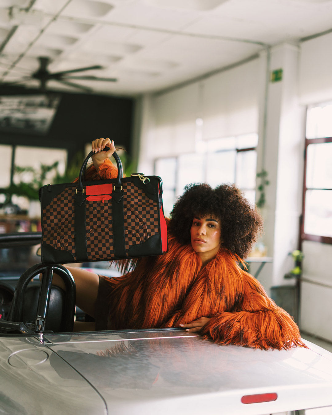 SPRAYGROUND® DUFFLE RED REDEMPTION PYRAMID DUFFLE