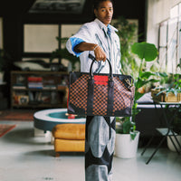 SPRAYGROUND® DUFFLE RED REDEMPTION PYRAMID DUFFLE