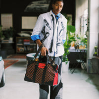 SPRAYGROUND® DUFFLE RED REDEMPTION PYRAMID DUFFLE