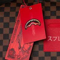 SPRAYGROUND® DUFFLE RED REDEMPTION PYRAMID DUFFLE