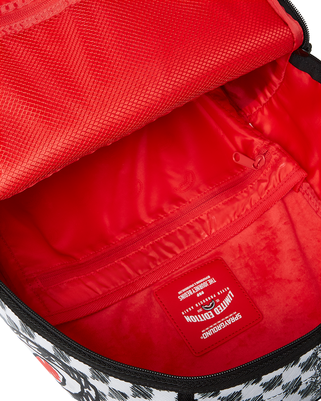 SPRAYGROUND® BACKPACK SCRIBBLE DRIBBLE CHECK BACKPACK