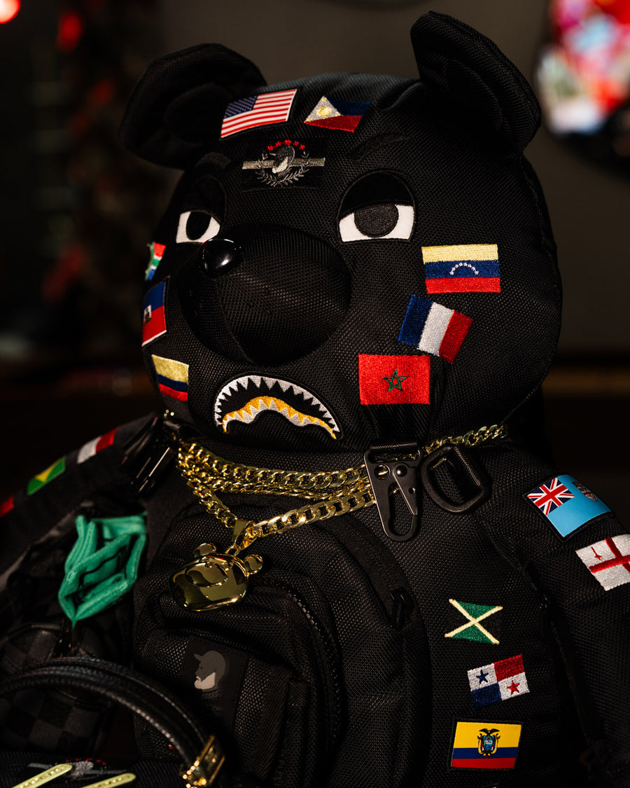 SPRAYGROUND® BACKPACK JAMES FLAGS MONEY BEAR BACKPACK