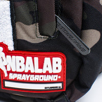 SPRAYGROUND® BACKPACK NBALAB KYRIE IRVING CAMO PATCHES