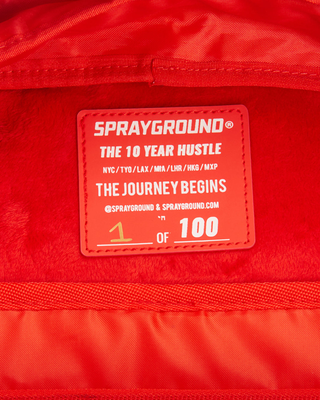 SPRAYGROUND® BACKPACK THE 10 YEAR HUSTLE BACKPACK. MYSTERY BOX. NUMBERED 1 OF 100