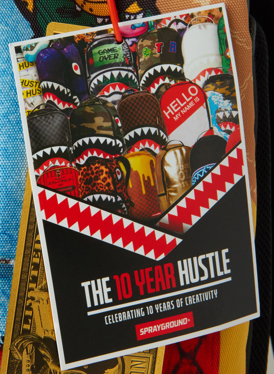 SPRAYGROUND® BACKPACK THE 10 YEAR HUSTLE BACKPACK. MYSTERY BOX. NUMBERED 1 OF 100