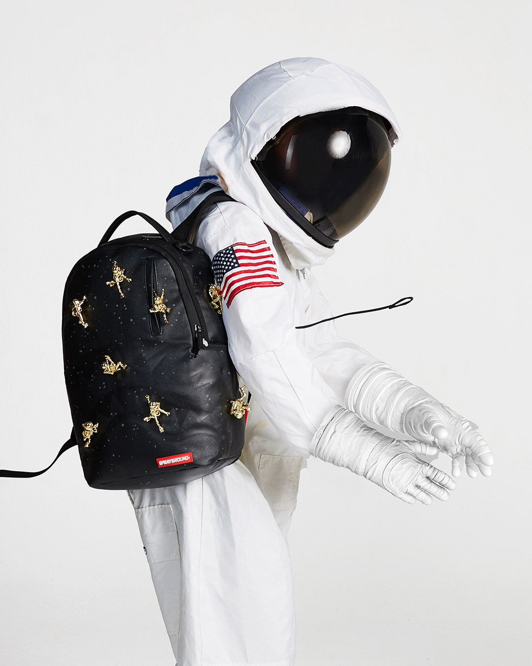 SPRAYGROUND® BACKPACK THE LOST IN SPACE BACKPACK (10 3D GOLD METAL ASTRONAUTS)