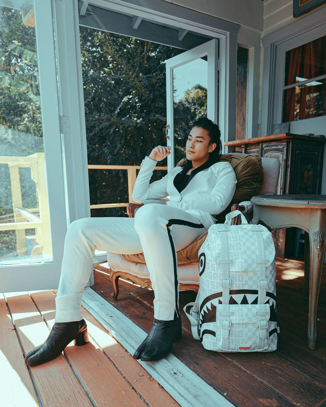 Sprayground split online the check backpack