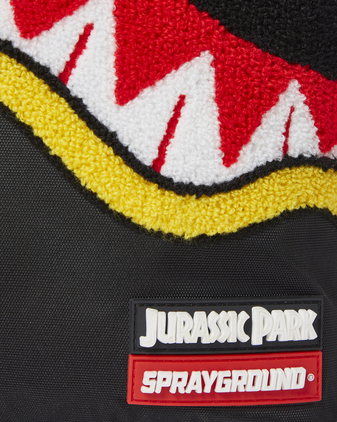 SPRAYGROUND® BACKPACK JURASSIC PARK SHARK "CHENILLE SHARK" BACKPACK (DLXR)