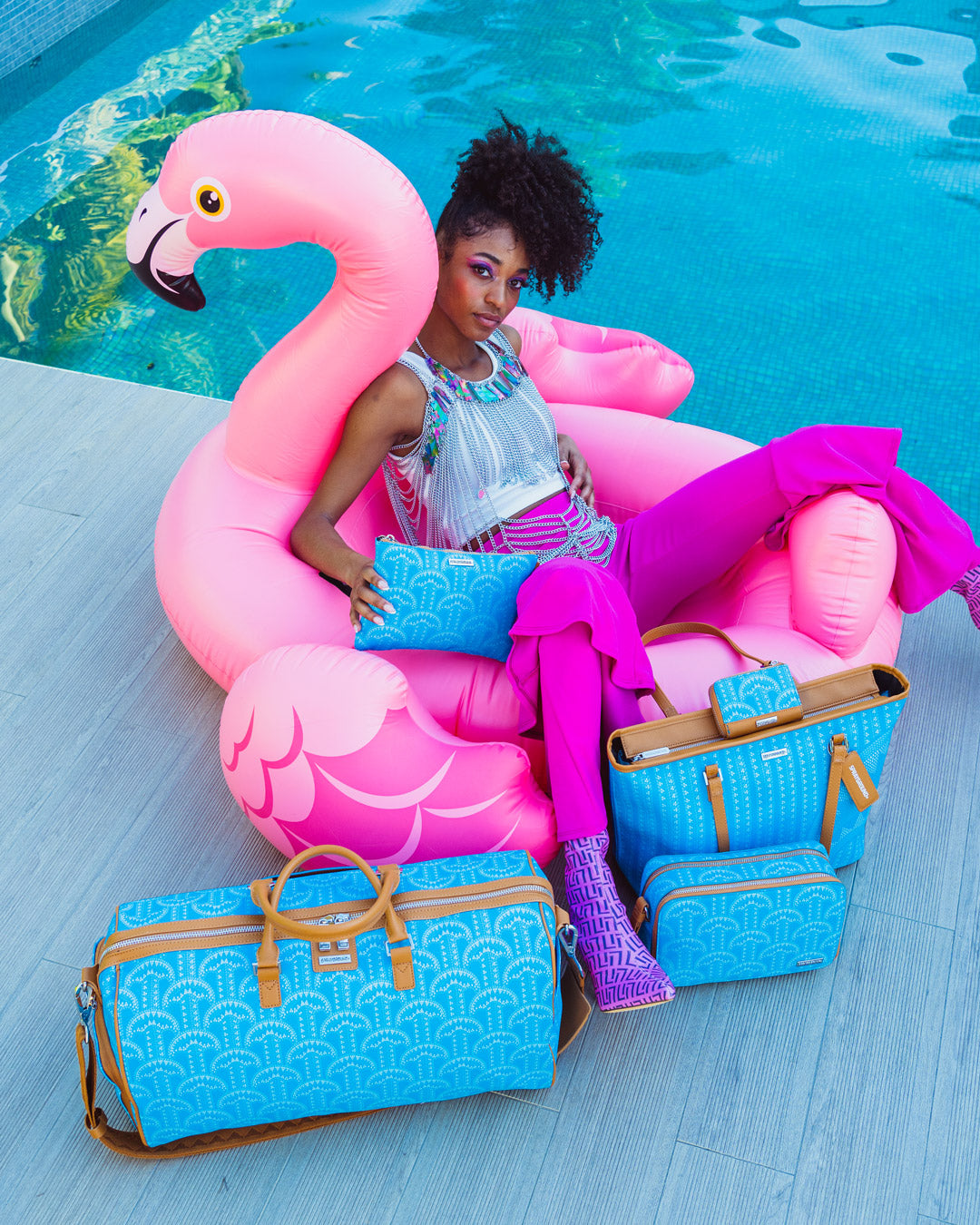 SPRAYGROUND® POUCHETTE ILLUCHAINS TURQ CROSSOVER CLUTCH