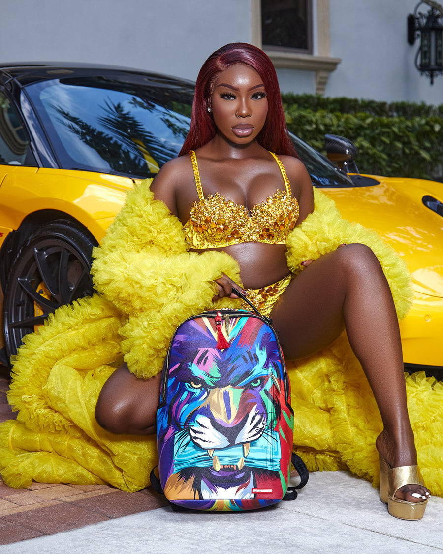 SPRAYGROUND® BACKPACK HEAR MY ROAR A.i.6 SANDFLOWER COLLAB BACKPACK (DLXV)