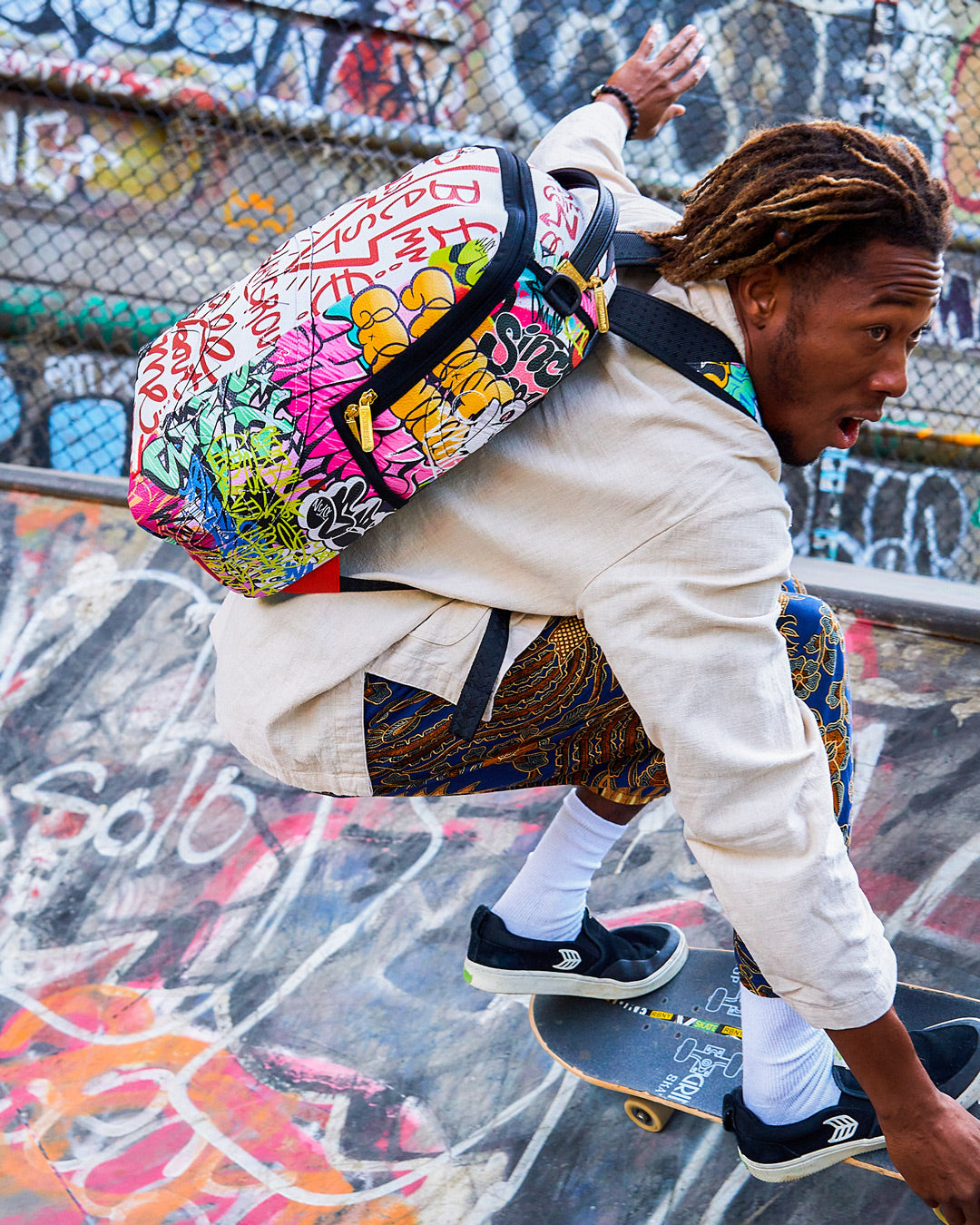 SPRAYGROUND® BACKPACK TRI-SPLIT GRAFFITI BACKPACK (DLXV)