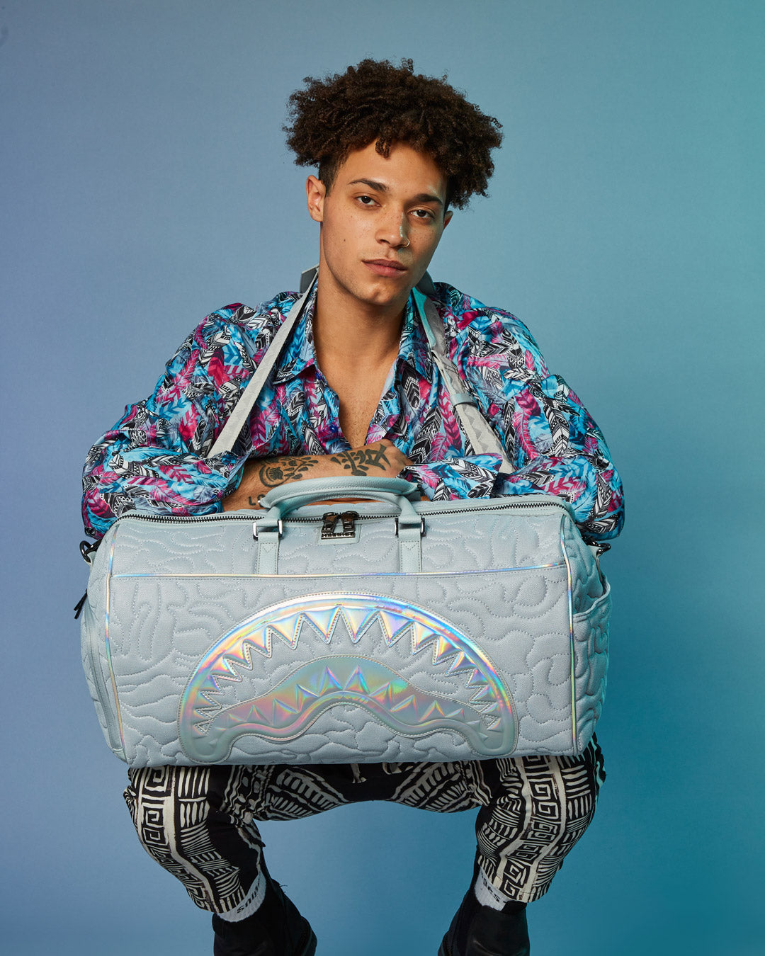 SPRAYGROUND® DUFFLE MIRASHAKU IRIDESCENT QUILT DUFFLE