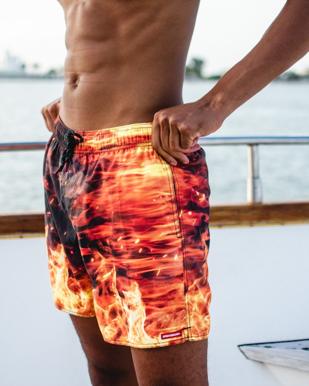 SPRAYGROUND® SWIM CAMO FIRE SHOTO SWIM TRUNKS